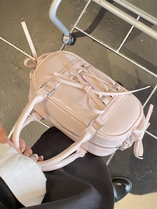 Pink patent leather Boston bag with ribbon bow design and dual handles for women