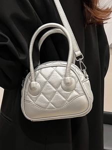 Minimalist silver quilted boston handbag with metallic finish and top handles