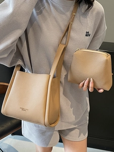 Minimalist beige lychee pattern bucket bag set with matching pouch and long strap