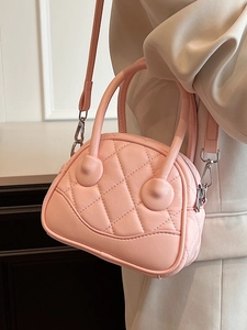 Pink quilted Boston bag with silver hardware and adjustable strap for elegant women