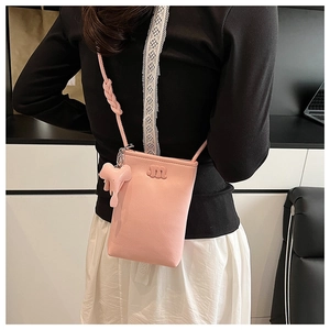 Pink minimalist crossbody phone bag featuring a letter M logo and a cute elephant charm