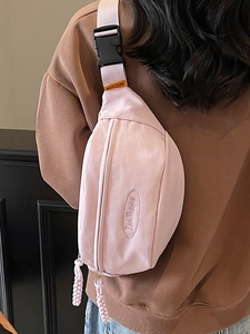 Minimalist light pink nylon crossbody chest bag with adjustable strap and logo detail