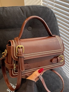 Retro brown leather square handbag with dual handles and gold hardware details