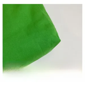 Detailed close-up showing the dense green canvas weave texture of this tote shoulder bag