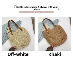 Detail of straw tote bags in beige and khaki with leather handles and cross stitching