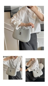 Detailed views showing grey half-moon underarm bag with vintage metal clasp worn by model