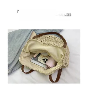 Top view of large capacity straw tote bag interior with tablet and daily essentials