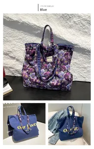 Detail view of large canvas tote bags in blue and purple floral patterns for daily use