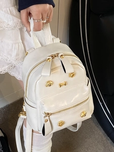 Mini cream PU leather backpack with gold puppy rivets and glossy finish for women