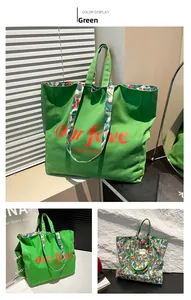 Macro detail of green canvas tote bag featuring floral lining and red slogan text