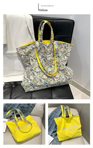Detail view of the reversible floral and solid yellow canvas tote bag with slogan