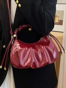 Retro burgundy oil-waxed leather hobo bag with pleated details and golden hardware