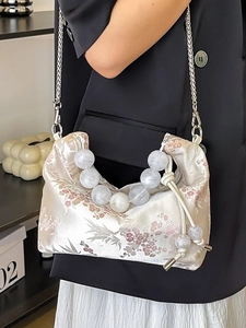 Elegant Chinese style beige handbag with flower embroidery and decorative pearl beads