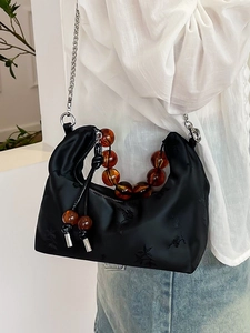 Chic black crescent hobo bag with plum blossom embroidery and amber beaded handle