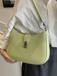 Chic light green underarm bag in half-moon shape with metallic buckle for women