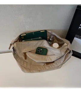 Macro view showing spacious main compartment and interior zipper pocket of the canvas tote