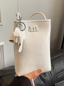 Minimalist cream white crossbody phone bag with pleated texture and cute elephant charm