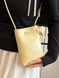 Minimalist cream yellow crossbody phone bag with litchi texture and m-letter detail