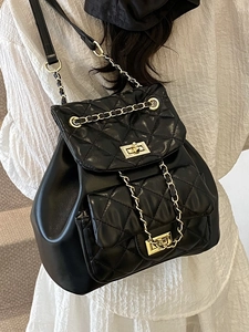 Chic black quilted leather backpack with gold chain straps and diamond lattice pattern
