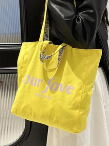 Yellow canvas tote bag with 'Enjoy your life' print and floral lining detail