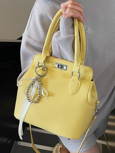 Chic yellow lychee pattern Kelly bag for women with elegant ribbon pendant and strap