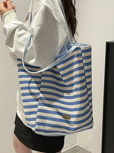 Blue and white striped canvas tote bag with herringbone texture and large capacity