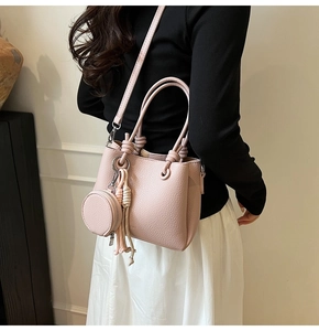 Pink lychee texture bucket bag with round coin purse charm and detachable shoulder strap