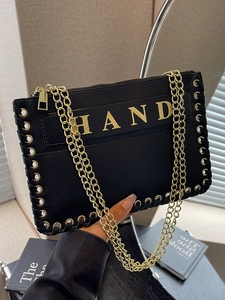 Chic black woven envelope bag with gold HAND lettering and metallic chain strap