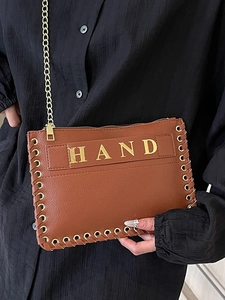 Brown textured leather woven envelope bag with gold HAND lettering and chain strap