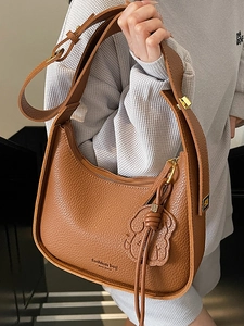 Brown litchi grain leather hobo underarm bag with gold zipper and puppy charm