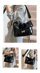 Détail du sac fourre-tout en cuir verni noir avec nœud argenté et cordon tressé
