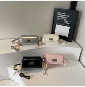Four colors of faux leather pillow bags with metal locks and cute bear charms