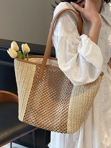 Two-tone hollow straw tote bag with brown leather straps and beige woven mesh