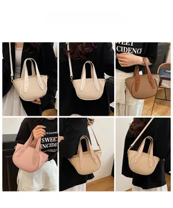 Detail shot of textured woven bucket bags in beige, brown, and pink with crossbody straps