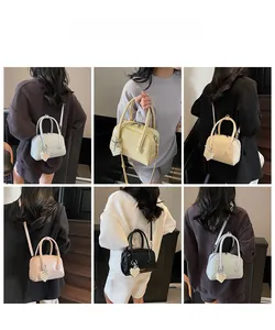 Multiple colors of chic Boston bags showing light blue, yellow, and pink crossbody styles