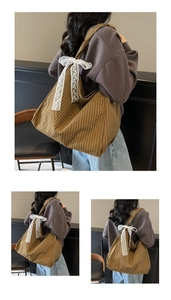 Detail of brown plaid tote bag with white lace bow and large capacity for women
