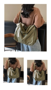 Detail of green checkered shoulder bag featuring a decorative white lace bow and canvas strap