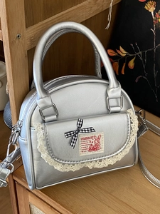 Silver metallic Boston handbag with lace details and a checkered bow for women