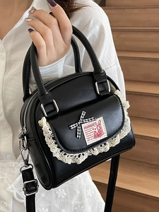 Sweet ballet style black PU Boston handbag with cream lace trim and bow accents