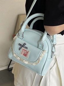 Light blue Boston handbag with lace trim, checkered bow, and cartoon rabbit patch