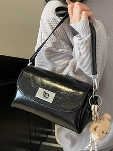 Classic black oil wax leather pillow bag with silver buckle and plush bear pendant