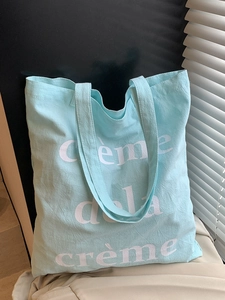 Sac fourre-tout en toile vert menthe avec inscription Creme de la creme style décontracté