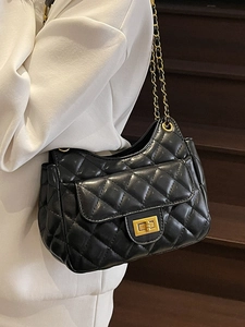 Classic black quilted leather shoulder bag with gold chain strap and turn-lock closure