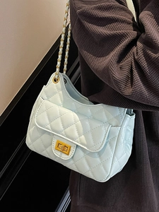 Quilted light blue chain shoulder bag with gold hardware and square twist lock