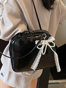 Elegant black glossy underarm bag with lace pearl bow in trendy balletcore style