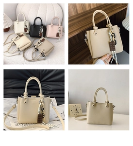 Détail de sacs en cuir à motif litchi avec chaîne acrylique et bijou chocolat