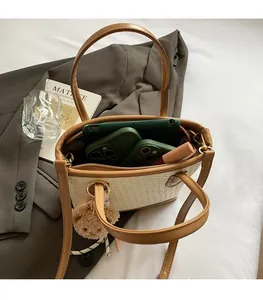 Interior view of beige woven tote bag showing large capacity for tablet and accessories