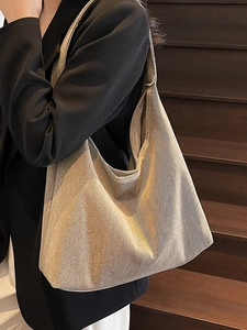 Minimalist large champagne gold tote bag with metallic texture for daily commuting fashion