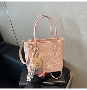 Pink woven texture bucket bag with adjustable strap and cute brown plush bear charm