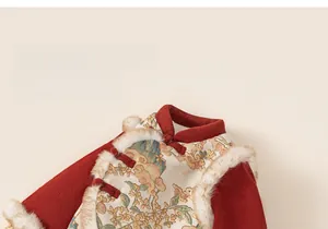 Close-up of traditional red floral jacquard fabric with white faux fur collar and buttons